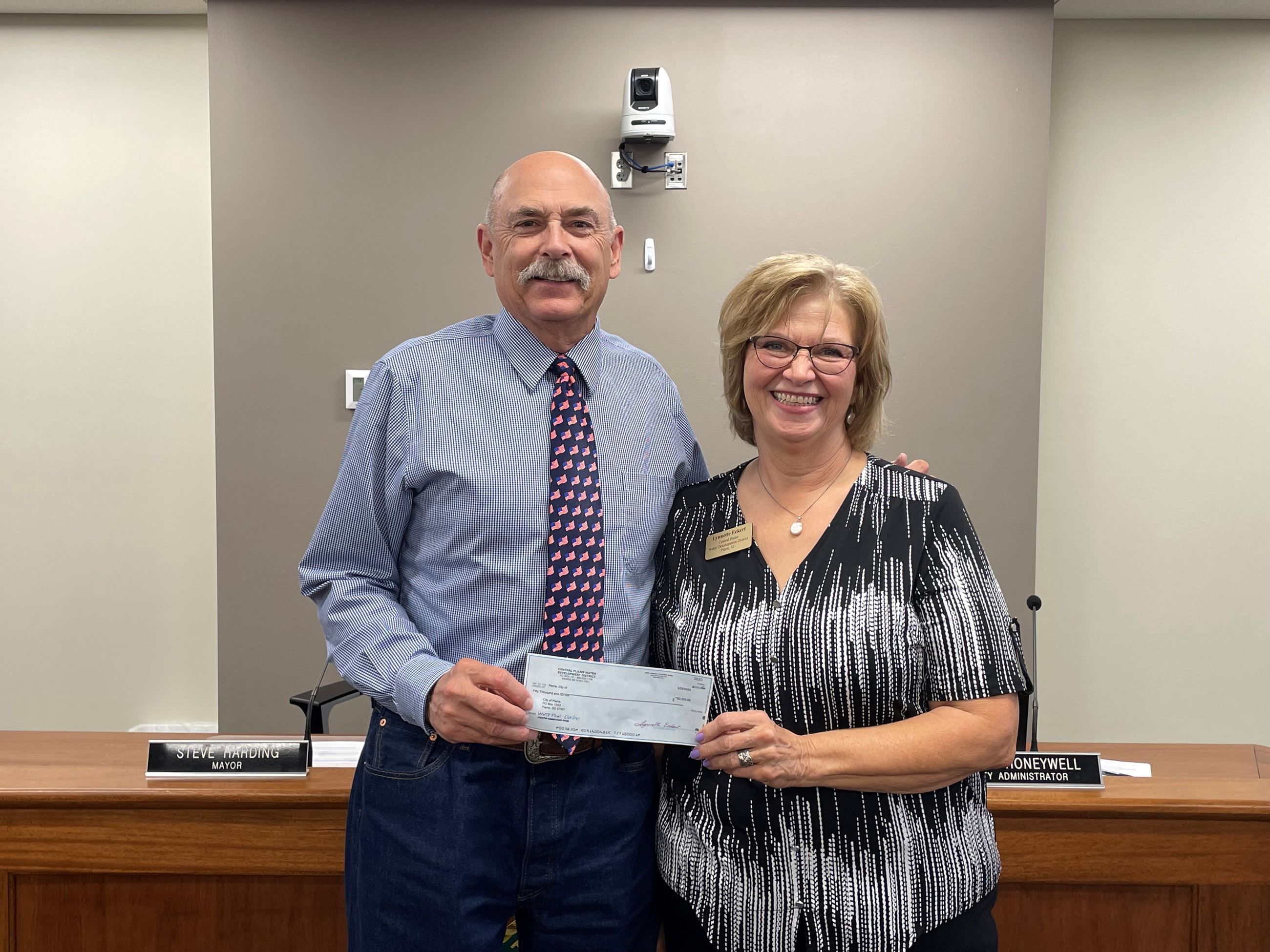 MAYOR HARDING ACCEPTING CHECK FROM LYNNETTE ECKERT, WATER DEVELOPMENT DISTRICT